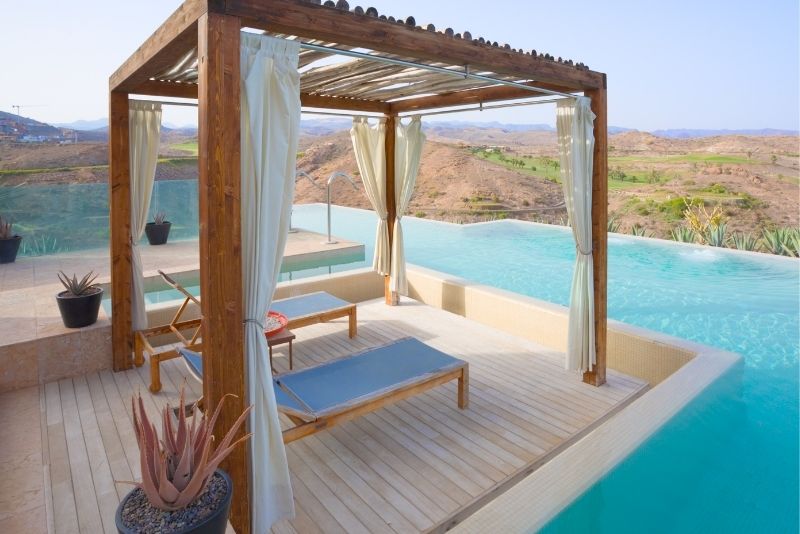 A pergola near a pool