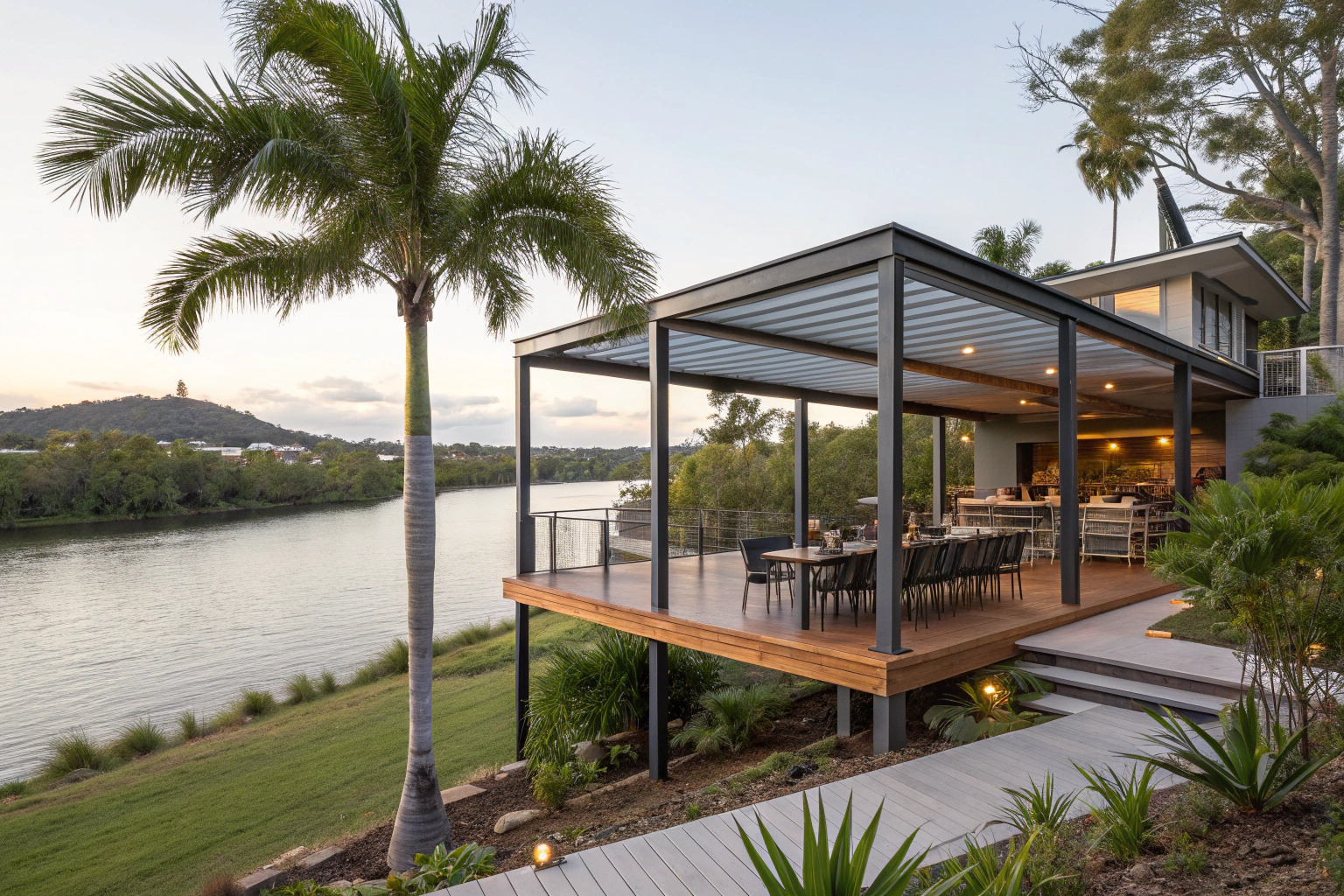 An elevated modern steel-framed pergola deck overlooking the Maroochy River at dusk