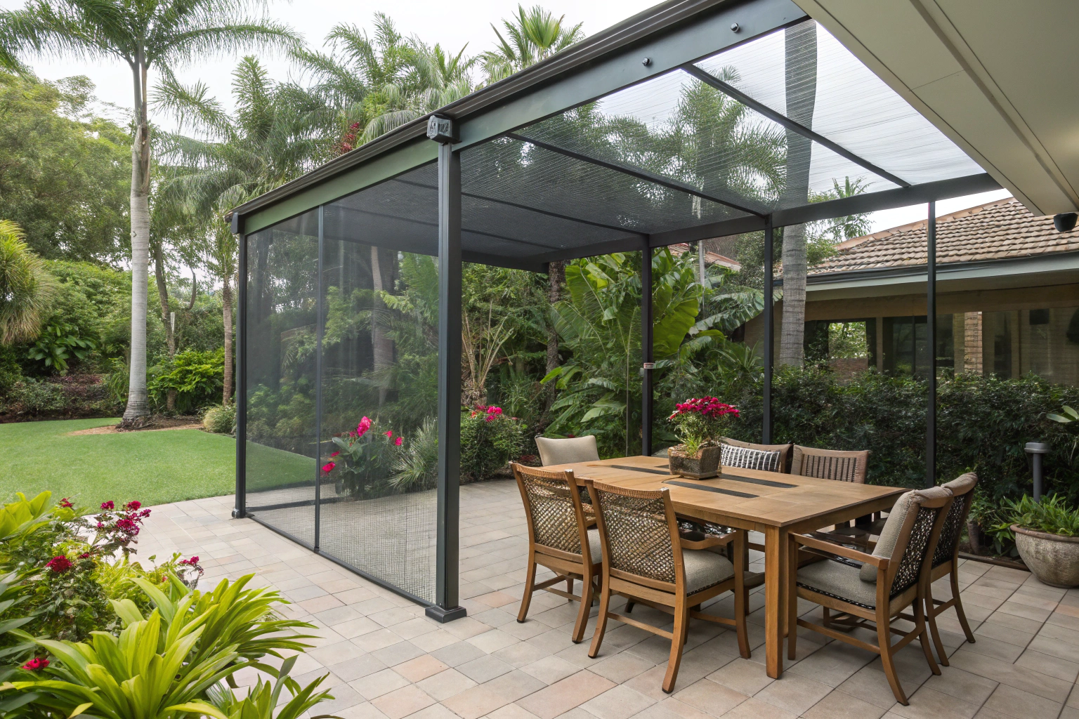 Outdoor dining area protected by a fine mesh insect screen