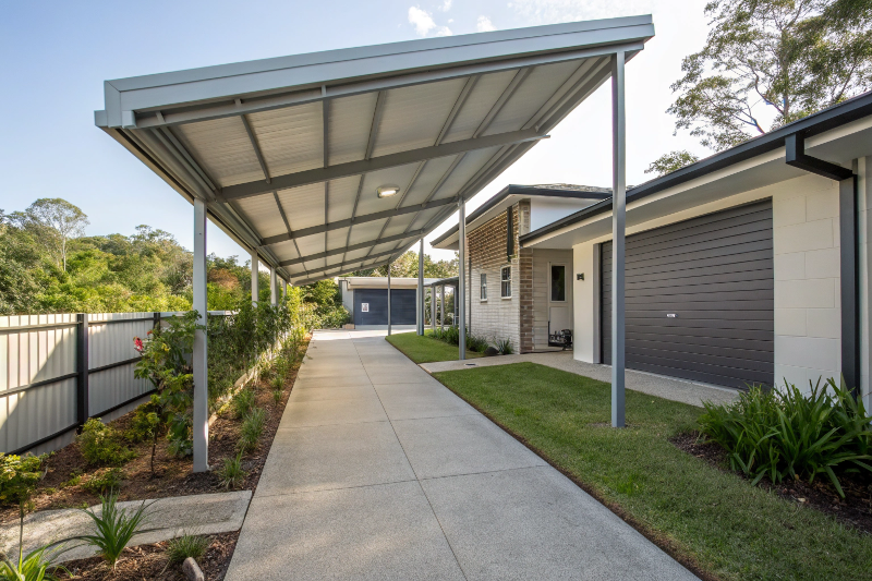 Aluminium covered walkway with Colorbond roofing connecting a home to a garage